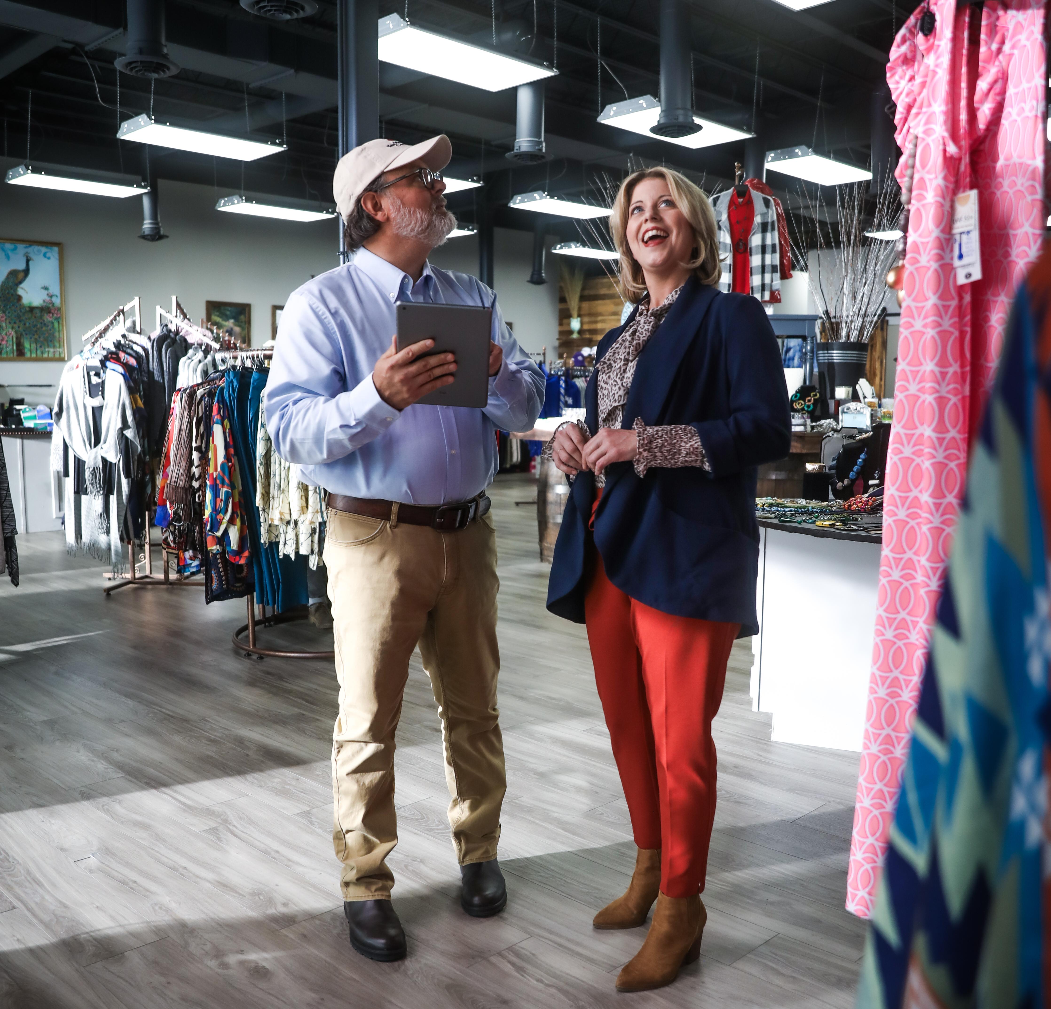 man and woman shopping in local boutique
