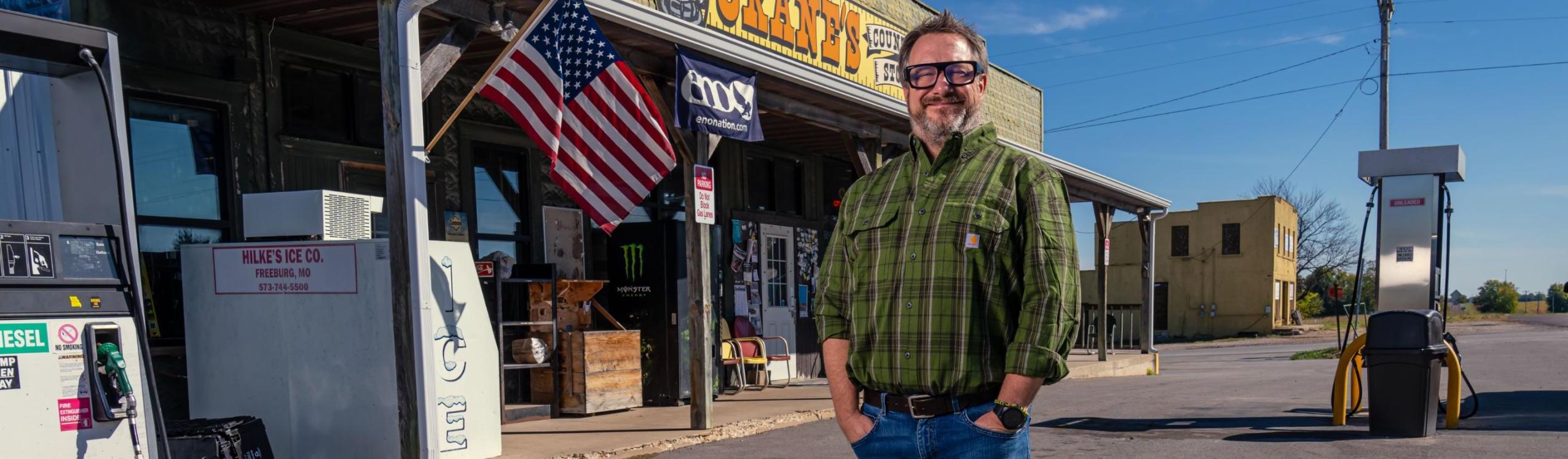 Man standing in front of store outside